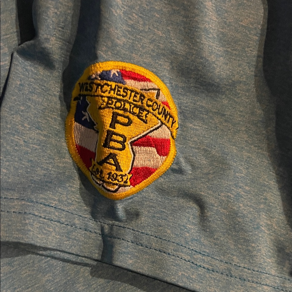 Westchester County Police PBA Arm Patch on Oakley Blue Golf Shirt